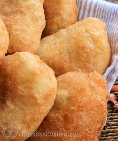 a basket filled with fried food sitting on top of a table