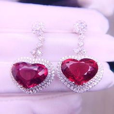 16.8ct Rare Natural Rubellite Earrings, Heart Shaped Red Tourmaline Drop Earrings with Real Diamonds, 18K solid White Gold, with CertificateA Pair of Stunning 18k White Gold earrings set with 16.85ct natural red rubellite. Excellent fire and brilliance. The color of the Rubellite is a fiery vivid red which is ultra rare and highly valued. This precious gem is surrounded with REAL diamonds. This pair of earrings is a wonderful piece of craftsmanship and one of a kind. Gemstone: Natural Rubellite Valentine's Day Formal Heart Gemstone Earrings, Ruby Earrings For Valentine's Day, Red Heart-shaped Earrings For Formal Occasion, Elegant Red Heart-shaped Earrings, Elegant Red Heart Earrings For Formal Occasions, Elegant Red Heart Earrings For Formal Events, Formal Fine Jewelry Heart Earrings With Gemstone, Heart Cut Earrings For Valentine's Day Formal Occasions, Heart Cut Earrings For Valentine's Day Formal