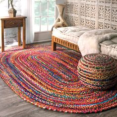 a living room with a couch and rug on the floor