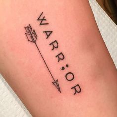 a tattoo that says warrior with an arrow on the side of its arm and is in black ink