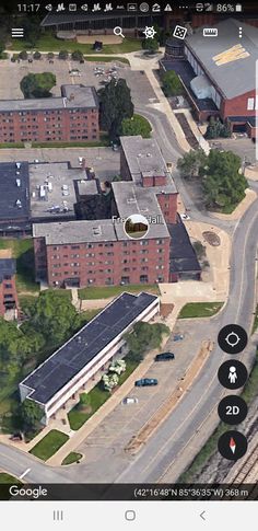 an aerial view of a train station and surrounding buildings