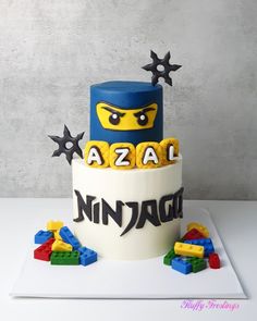 a lego themed birthday cake with the name aza ninja written on it's side