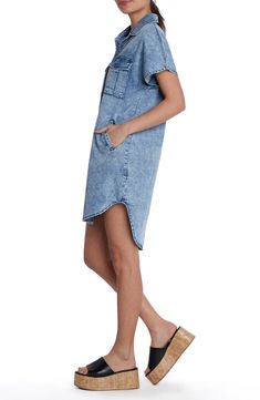 This season-staple denim dress is designed with abbreviated sleeves and a curved high-low hem. Front button closure Spread collar Short sleeves Chest button-flap patch pockets; side pockets 62% lyocell, 20% cotton, 12% polyester, 5% rayon, 1% spandex Machine wash, tumble dry Imported Summer Denim Washed Shirt Dress, Casual Summer Shirt Dress With High-low Hem, Casual High-low Hem Shirt Dress For Summer, Spring Casual Shirt Dress With Curved Hem, Casual Spring Shirt Dress With Curved Hem, Casual Shirt Dress With Curved Hem For Spring, Casual High-low Hem Shirt Dress For Spring, Knee-length Denim Shirt Dress For Daywear, Denim Shirt Dress