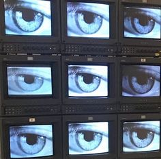 several televisions with different types of eyes on them