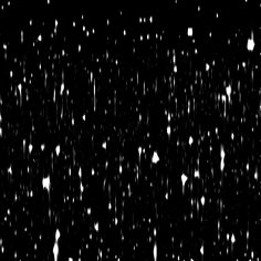 black and white photo of snow falling down