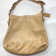 Preowned Coach Peyton Leather Shoulder Bag In Caramel Color. Beautiful Buckles. Magnetic Snap Closure. Belt Strap That Is Adjustable To 3 Hole Position On Each Side Of Strap. Coach Leather Hangtag. Inside Lined With Poppy Polka Dot Lining- Cutie. Back Interior Zippered Compartment With Coach Creed And Two Front Wall Interior Slip Pockets. See Pictures For Condition. Some Noticeable Wear, But Still A Very Beautiful Purse. Coach Leather Hobo Bag With Gold-tone Hardware, Caramel Leather Shoulder Bag With Removable Pouch, Beige Leather Hobo Bag With Handle Drop, Elegant Caramel Soft Leather Shoulder Bag, Elegant Light Brown Soft Leather Hobo Bag, Designer Beige Leather Hobo Bag, Camel Leather Bag With Gold-tone Hardware, Caramel Leather Bag With Gold-tone Hardware, Chic Caramel Leather Shoulder Bag