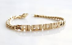 "Because the best name to drop is your own. DETAILS - Crafted from genuine solid 14k gold - 8\" length bracelet (standard men's size) - Chain style may vary slightly - Made in New York VARIATIONS If you require any variation of this style (different chain length, etc.), feel free to message us. We will do our best to accommodate you. Additional costs may apply depending on the variation. POLICY This item is made to order. Made to order items are final sale and sometimes require additional produc Modern Engraved Yellow Gold Name Bracelet, Lock Style, Name Bracelet, Cool Names, Chain Link Bracelet, Chain Styles, Chain Lengths, Chain Length, Chain Bracelet