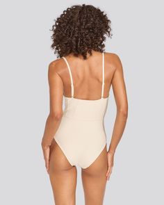 Chic and retro-inspired, The Veronica One-Piece is a luxe staple. This moderate coverage one-piece offers support with underwire cups and adjustable straps. Wear it to the beach or with your favorite pair of pants to double as a bodysuit. Underwire Bodysuit With Built-in Bra For Vacation, Nylon Bodysuit With Built-in Bra For Vacation, Solid Color Underwire Bodysuit For Vacation, Solid Underwire Bodysuit For Sunbathing, Summer Poolside Bodysuit With Built-in Bra, Underwire Bodysuit With Built-in Bra For Sunbathing, Underwire Swimwear With Built-in Bra, Summer Bodysuit With Built-in Bra For Vacation, Solid Color Underwire Bodysuit For Beach Season