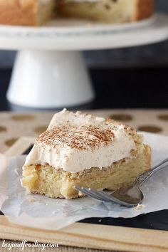 a piece of cake sitting on top of a white plate with a fork in it