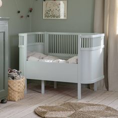 The new luxury Sebra cot bed in mist green is designed to grow with your child and can be used from birth all the way up to 8 years old. The bed is equipped with a height-adjustable base and removable side panels that transform the cot into a junior bed. The adjustable mattress is also available to add to your order, this comes in two parts, one which fits the cot and an additional panel as your child grows. Available in the classic style or the harmony which is a high-quality specialty version Sebra Bed, Baby Cot Bedding, Junior Bed, Daybed Covers, Bed Shelves, Beige Bed, Pull Out Bed, Adjustable Mattress