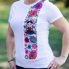 Beautiful One Of A Kind T-Shirt, Features A Mexican Doll Design With Colorful Flowers, This Is A Great Gift For The Mexican Culture Lover! Pastel Blouse, Magenta Top, Mexican Doll, Royal Blue Top, Doll Design, Mexican Embroidery, Mexican Blouse, Teal Blouse, Embroidery Tshirt