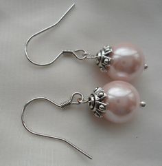 PREFERENTIAL POLICIES : The order is $25 or more.There will be a 10% discount.long-term effective. Please use the coupon code: CZH10 Welcome back to my shop: https://www.etsy.com/shop/pearlandjewelry Description of the product in the picture: I make them with 10mm light pink glass pearls and sterling silver hook (the other metal are alloy),It is nice for your wedding. The picture color is light pink. Can choose other colors are:ivory,white,light pink,Black, red, teal, gray, dark gray, turquoise, Cheap Pink Pearl Earrings For Gift, Pink Pearl Earrings For Gift, Cheap Pink Pearl Drop Earrings, Elegant Pink Sterling Silver Pearl Earrings, Pearl Dangle Earrings Wedding, Pink Pearl Charm Wedding Earrings, Ivory Pearl Necklace, Pink Pearl Earrings, Pink Pearl Necklace