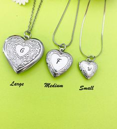 "This is a unique engraving initial on stainless steel heart locket charm on 18 inches stainless steel necklace chain.  I do not put the photo to the locket HOW TO ORDER 1) Select the quantity 2) Select stamp the initial and style  3) Add to cart DESCRIPTION ♥ Necklace, Stainless Stee Chain with Lobster Claw Clasp, Size: about 17.7 inches (45cm) long, 1-2mm wide, Nickel Safe, ♥ LARGE, 304 Stainless Steel Locket Pendants, Photo Frame Charms for Necklaces, Heart, Platinum, Size: about 29mm (1 1/8\") wide, x 29mm (1 1/8\") long, 7mm thick; Fits photo 21mm or 7/8\" (W)x17mm or 5/8\"(H) OR ♥ MEDIUM, 316 Stainless Steel Locket Pendants, Photo Frame Charms for Necklaces, Heart, Stainless Steel Color, Size: about 0.77-inch(19.5mm) wide, 0.89-inch(22.5mm) long, 0.20-inch(5mm), inner (fit photo) dia Silver Locket Charm Necklace For Valentine's Day, Silver Charm Necklace For Valentine's Day Keepsake, Silver Heart Charm Locket Necklace For Mother's Day, Silver Nickel-free Locket Necklace For Valentine's Day, Mother's Day Silver Heart Charm Locket Necklace, Silver Round Locket Necklace For Valentine's Day, Valentine's Day Silver Locket Necklace, Nickel Free, Silver Locket Necklace For Valentine's Day, Valentine's Day Silver Locket Necklace Nickel Free