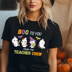 The students will surly love this cute Halloween Ghost shirt. This T-shirt is also a great teacher gift. Thank you for supporting my small business. This classic unisex jersey short sleeve tee fits like a well-loved favorite. Soft cotton and quality print make users fall in love with it over and over again. These t-shirts have-ribbed knit collars to bolster shaping. The shoulders have taping for better fit over time. Dual side seams hold the garment's shape for longer.  .: 100% Airlume combed and ringspun cotton (fiber content may vary for different colors) .: Light fabric (4.2 oz/yd² (142 g/m .: Retail fit .: Tear away label .: Runs true to size Black Fall School T-shirt, Black T-shirt For School In Fall, Black T-shirt With Funny Text For School Spirit, Black School Spirit T-shirt With Funny Text, Fun Black T-shirt For School, Black T-shirt With Funny Text For School, Black Top With Custom Print For Teacher Appreciation, Funny Black T-shirt For School, Custom Print Black Top For Teacher Appreciation