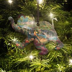 an ornament hanging from a christmas tree with the image of disney's elephant