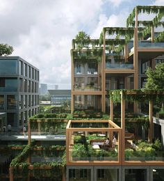 a group of buildings with trees growing on the top and bottom floors, all surrounded by greenery