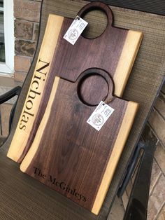 a cutting board sitting on top of a chair next to a fire place with two knives in it