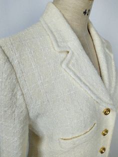 Beautiful vintage Sonia Rykiel skirt suit. Made from ivory wool/rayon boucle, with gold tone metal logo buttons. The suit consists of: -a longline blazer featuring shoulder padding, double patch pockets and chest pockets -a pencil skirt with back zipper closure. Both are fully lined. Made in France. SIZE TAG: is missing, estimated FR42. Please see measurements below. FABRIC CONTENT: tag is missing, definitely wool with a little rayon. CONDITION: excellent, no damage or stains. MEASUREMENTS (taken flat, not doubled): Blazer: Shoulder: 41 cm / 16" Bust: 51 cm / 20" Waist: 43 cm / 17" Length: 66 cm / 26" Sleeve length: 58 cm / 23" Skirt: waist: 38 cm / 15" Hip: 50 cm / 19 3/4" Length: 51 cm / 20" Please do not hesitate to contact me if you have any questions. Chic Cream Tweed Jacket For Formal Occasions, Formal Cream Tweed Jacket, Classic White Tweed Jacket With Button Closure, Classic Cream Tweed Blazer, Vintage White Formal Blazer, White Vintage Formal Blazer, Elegant Cream Single-breasted Tweed Jacket, Classic White Tweed Jacket With Buttons, Elegant Cream Tweed Jacket Single Breasted