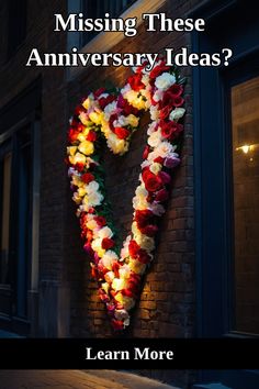 a heart made out of flowers on the side of a building with text that reads, missing these anniversary ideas? learn more