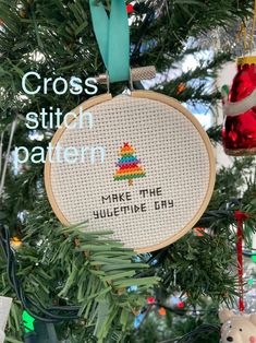 cross stitch kit hanging from a christmas tree