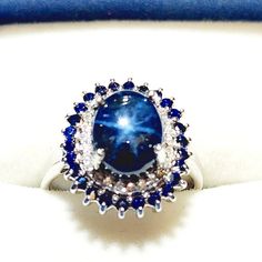 a blue and white ring sitting on top of a table