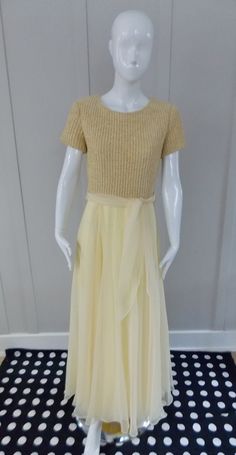 "Short sleeved,round necked ballgown Bodice is knitted with chenille yarn Full skirt is chiffon with a narrow hen Bodice is fully lined and skirt is double lined Chiffon tie belt Centre back lapped nylon zipper Labelled \" Robert Courtney\"  \"Made Expressly for frances brewster\" Robert Courtney of Los Angeles originally worked for Charles Cooper, a couture designer of the 1950's and 1960's, as the V.P. Sales He opened his own company in 1969. He designed clothes and sewing patterns in the 1970 Designed Clothes, Vintage Formal Dresses, Own Company, Chenille Yarn, Couture Designers, Fine Fabric, Pale Yellow, Vintage Dress, Full Skirt