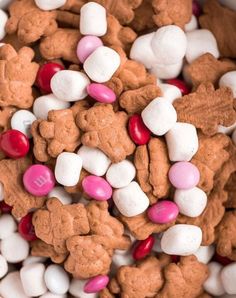 a bowl filled with lots of white and pink candies