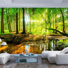 a living room with a couch, coffee table and wall mural