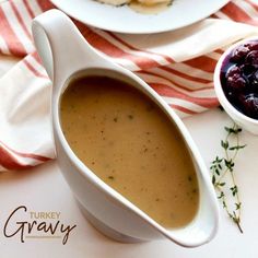 two plates with food on them, one has soup in it and the other has bread