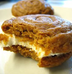 two pieces of dessert sitting on top of a white plate