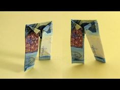 an origami style tie made out of money