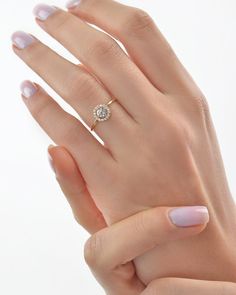 a woman's hand with a ring on it