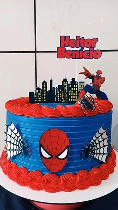 a spiderman themed birthday cake on a table