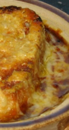 a casserole dish with cheese and sauce in it