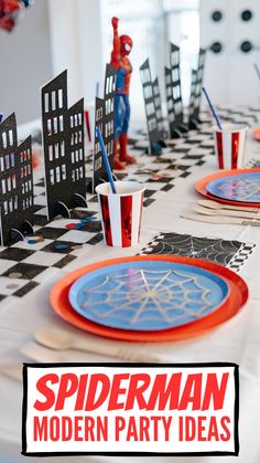 a spiderman themed party table setting with paper plates and napkins, cups and forks