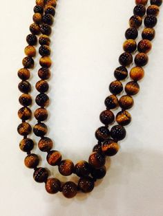 Gorgeous and delicate hand knotted Tiger's Eye long necklace 62 in long No clasp All jewelry is shipped in a nice gift box. Check out our over a THOUSAND great reviews Vintage Tiger, Tiger Eye Beads, Tigers Eye, Tiger's Eye, Tiger Eye, Beaded Necklaces, Long Necklace, Tigers, Necklace Etsy