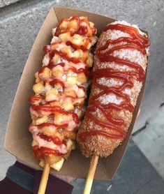 two skewers filled with different kinds of food