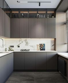 a kitchen with marble counter tops and cabinets