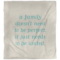 a blanket with the words, a family doesn't need to be perfect it just needs to be united