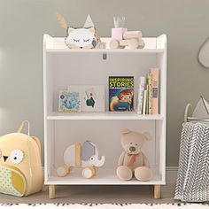 a white book shelf with stuffed animals and books on it in a child's room