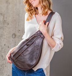 "❤️ The sharp-looking Leather Sling Bag with your fire branded name. This crossbody bag is handcrafted from Italian full grain leather ❤️ ❶ Pick your favorite color ❷ Add your name, initials or a quote and make it a unique gift. We will fire brand it for your loved ones. ❸ THE LEATHER & MAKE Full-Grain Italian leather of top quality. With regular use, your sling bag will age gracefully, developing a rich patina and distinctive character ✅ 2 Metal zippers ✅ Adjustable shoulder strap ✅ Zippere Leather Bum Bag, Leather Portfolio, Leather Sling Bag, Shoulder Bag Brown, Women Leather Backpack, Briefcase For Men, Leather Gifts, Leather Bags Handmade, Bum Bag