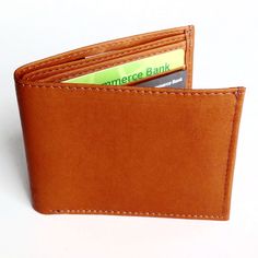 Genuine leather wallet with a fold out photo ID window and eleven interior credit card slots. Handmade in Ecuador Approximate dimensions: 3.5" x 8.7" when open Genuine leather With every product you purchase, you are helping provide employment, educational opportunities and medical care to artisans in Ecuador. Father's Day Gifts, Credit Card Wallet, Leather Bifold Wallet, Genuine Leather Wallets, Bifold Wallet, Medical Care, Classic Leather, Paper Cards, Low Key