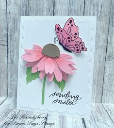 a pink flower with a butterfly on it