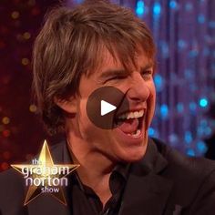 a man laughing and holding his mouth open with an award in front of him on the graham horton show