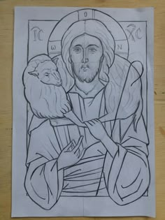 a drawing of jesus holding a sheep