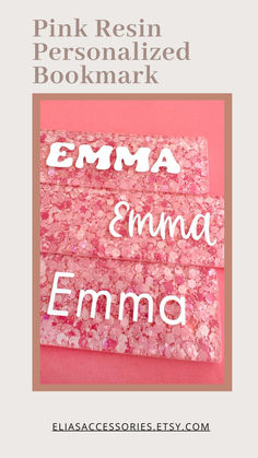 pink resinonized bookmark with the words ema and emo on it