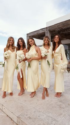 the bridesmaids are all dressed in yellow dresses