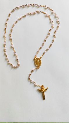 Unlike conventional rosaries, ours are designed with a special technique that ensures durability and longevity with the thread folded to prevent any accidental breakage, offering peace of mind during your moments of prayer and reflection. Each rosary is meticulously crafted with a touch of reverence, using carefully selected materials that reflect both beauty and durability. Our signature piece features exquisite pink agate, chosen for its unique elegance and timeless appeal. As you hold one of Spiritual Gemstone Beads Rosary, Spiritual Beaded Rosary As Gift, Spiritual Beaded Rosary For Blessing, Healing Rosary With Miraculous Medal And Round Beads, Healing Rosary With Miraculous Medal, Gold Rosary For Meditation, Gold Rosary With 8mm Beads For Meditation, Adjustable Rosary With Miraculous Medal Gift, Gold Spiritual Rosary For Meditation