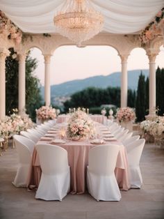 an outdoor wedding venue with tables and chairs set up for a formal dinner or reception