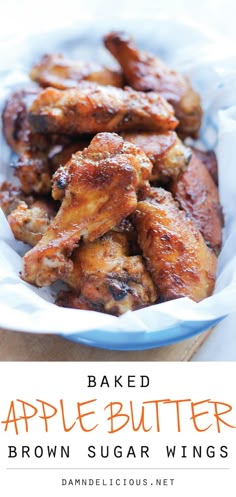 some chicken wings are in a blue bowl